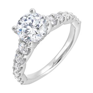 Dazzle with this gorgeous engagement ring featuring a round diamond center.  The shank is graduated with large round diamonds, set in shared prongs.